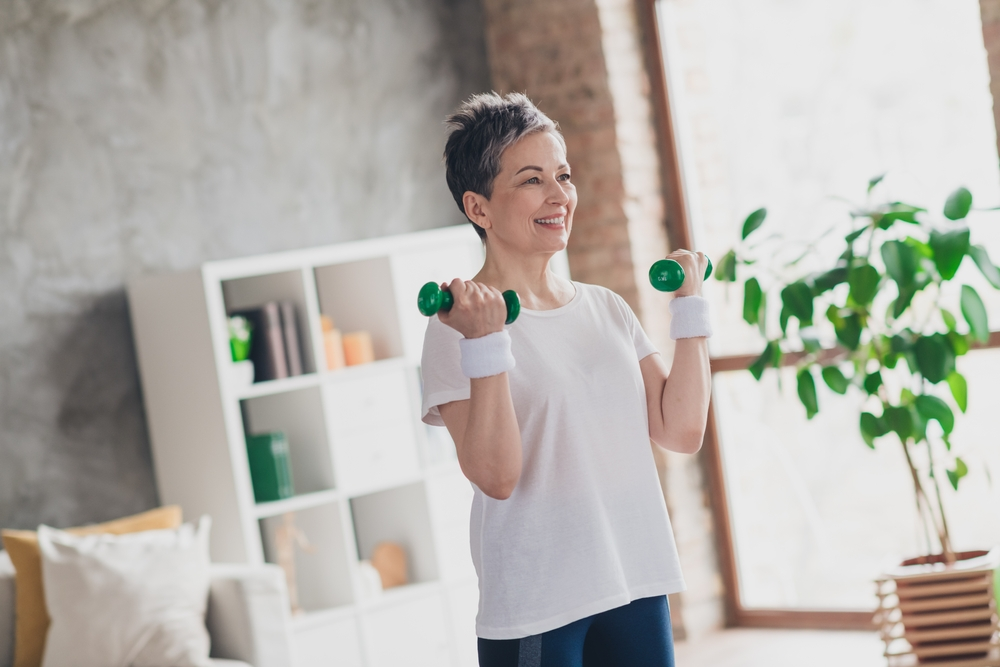 senior woman lifting dumbbells